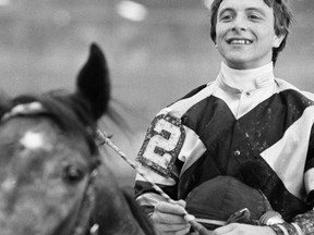 FILE - In this May 21, 1979, file photo, jockey Ronnie Franklin sits atop Spectacular Bid as they make their way to the winner's circle after winning the Preakness Stakes horse race at Pimlico Race Track in Baltimore, Md. Franklin, who rode Spectacular Bid to victory in the 1979 Kentucky Derby and Preakness, has died. He was 58. Franklin's nephew, Walter Cullum, said the former Maryland-based jockey died of lung cancer on Thursday, March 8, 2018. (AP Photo, File)