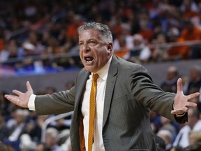 FILE - In this March 3, 2018, file photo, Auburn head coach Bruce Pearl reacts on the sidelines during the first half of an NCAA college basketball game against South Carolina, in Auburn, Ala. Pearl, a coach with an out-sized personality and checkered past, has led Auburn to its first NCAA Tournament in 15 years and a surprising SEC title but still faces questions about his job security amid an internal review of the program.
