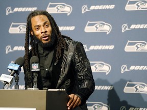 FILE - In this Oct. 29, 2017, file photo, Seattle Seahawks cornerback Richard Sherman talks to reporters during a post-game press conference following an NFL football game against the Houston Texans, in Seattle. The Seahawks are cutting ties with star cornerback Richard Sherman after seven seasons. The team has informed him that he will be released, and Sherman confirmed the decision in a text message to The Associated Press on Friday, March 9, 2018.