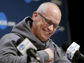 FILE - In this March 14, 2018, file photo, Rhode Island's head coach Dan Hurley takes questions during a news conference for an NCAA college basketball first round game in Pittsburgh. Rhode Island head basketball coach Dan Hurley has agreed to become the head coach at the University of Connecticut. Hurley replaces Kevin Ollie, who was fired earlier this month. UConn made the announcement Thursday morning, March 22, 2018, in a Tweet.
