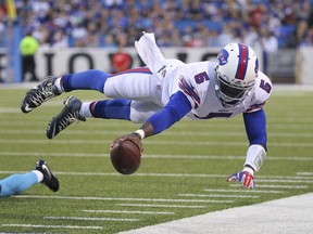 FILE - In this Aug. 15, 2015 file photo, Buffalo Bills quarterback Tyrod Taylor (5) dives for the first down marker during the first half of an NFL preseason football game against the Carolina Panthers in Orchard Park, N.Y. Two people familiar with the trade said Friday, March 9, 2018, the Cleveland Browns have agreed to acquire Taylor from the Bills for a third-round draft pick this year.