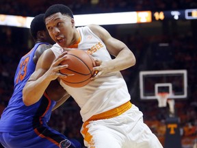 FILE - In this Feb. 21, 2018, file photo, Tennessee forward Grant Williams (2) drives the ball around Florida forward Kevarrius Hayes (13) during the first half of an NCAA college basketball game in Knoxville, Tenn. Williams was selected to the AP All-SEC team on Tuesday, March 6, 2018.