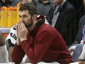 In this Jan. 8, 2018 file photo, Cleveland Cavaliers' Kevin Love watches from the bench in the second half of an NBA basketball game against the Minnesota Timberwolves in Minneapolis.