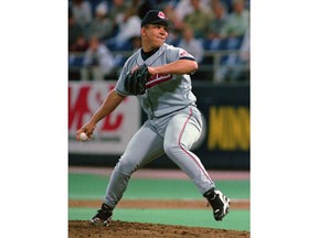 FILE - In this June 3, 1998, file photo, Cleveland Indians pitcher Bartolo Colon winds up to deliver to Minnesota Twins' Otis Nixon in the first inning of a baseball game, in Minneapolis. Colon, who turns 45 in May, is one of only two current MLB players who have played at least 20 seasons.