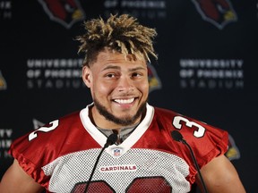 FILE - In this Oct. 19, 2017, file photo, Arizona Cardinals safety Tyrann Mathieu smiles during a press conference ahead of an NFL training session at the London Irish rugby team training ground in the Sunbury-on-Thames, suburb of south west London. The Cardinals have released Mathieu, on Wednesday, March 14, 2018, after the two sides couldn't rework his contract. Mathieu was due for $18.75 million of his contract to be guaranteed when the league year officially begins at 4 p.m. ET.