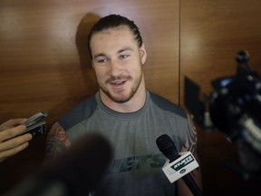 FILE - In this May 5, 2017, file photo, New York Jets' Dylan Donahue speaks to reporters during NFL football rookie minicamp in Florham Park, N.J.  Donahue recently checked himself into a substance-abuse treatment facility after being arrested for driving under the influence for the second time in less than a year. The 25-year-old Donahue was arrested and charged with drunken driving early on Feb. 26 after he drove the wrong way in the Lincoln Tunnel in New Jersey and collided with a jitney bus, injuring four people. Shortly after the incident, Donahue voluntarily entered rehab.