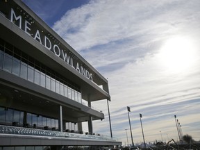 FILE - In this Nov. 20, 2013, file photo, letters spell out Meadowlands over top the new grandstand at the race track in East Rutherford, N.J. The CEO of Meadowlands, Jeff Gural, has been among the leaders in harness racing in trying to curb doping. Meadowlands revealed that Tag Up and Go had tested positive for EPO in 2016. The Tag Up and Go doping case emerged through one of his initiatives, establishing "out of competition" drug testing, which means horses can be subject to testing at any time, on the track or off.