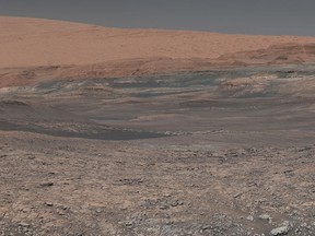 This image provided by NASA, assembled from a series of January 2018 photos made by the Mars Curiosity rover, shows an uphill view of Mount Sharp, which Curiosity has been climbing. Spanning the center of the image is an area with clay-bearing rocks that scientists are eager to explore; it could shed additional light on the role of water in creating Mount Sharp. On Thursday, March 2, 2018, NASA's Mars rover Curiosity marked 2,000 days on the red planet by Martian standards. A Martian sol, or solar day, is equivalent to 24 hours, 39 minutes and 35 seconds. So 2,000 days on Mars equal 2,055 days here on Earth. (NASA/JPL-Caltech/MSSS via AP)