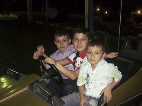 This 2013 family photo shows three brothers, from left, Ibrahim, Hasib and Amjud Moustafa Rifat, in the Middle East, less than a year after their family fled war-torn Syria. United States authorities granted the younger boys visas so they could travel with their parents to Columbus, Ohio, where they now live. But Hasib is still waiting for his paperwork to come through. Their father, Rifat Moustafa, says they will have to move to another country if they can't bring Hasib to the U.S. by the summer of 2018. (AP Photo/Moustafa Family)