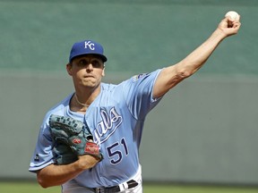 FILE- In this Oct. 1, 2017, file photo, Kansas City Royals starting pitcher Jason Vargas throws during the first inning of a baseball game against the Arizona Diamondbacks in Kansas City, Mo. Vargas is expected to miss four to six weeks after fracturing a bone in his right hand. The 35-year-old Vargas was hit on the hand by a line drive during a minor league game Friday, March 16, 2018.