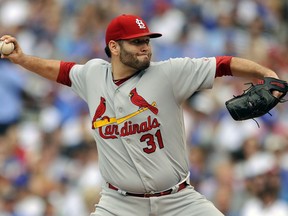 FILE - In this Sept. 17, 2017, file photo, St. Louis Cardinals starter Lance Lynn delivers a pitch during the first inning of a baseball game against the Chicago Cubs in Chicago. The Minnesota Twins have finalized a $12 million, one-year contract with right-hander Lynn, another patient, low-risk move toward strengthening their pitching staff. The deal was announced by the Twins on Monday, March 12, 2018.