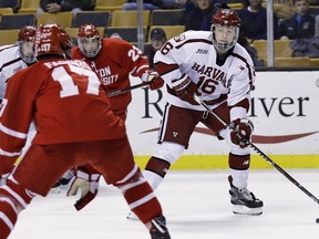 FILE- In this Feb. 5, 2018, file photo, Harvard forward Ryan Donato (16) looks to pass against Boston University during the second period of the first round of the Beanpot hockey tournament in Boston. The Boston Bruins have signed Donato to a two-year entry-level deal and say the U.S. Olympic star could play as soon as Monday, March 19, 2018.