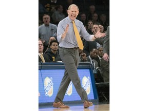 FILE - In this March 1, 2018, file photo, Michigan head coach John Beilein gestures during the second half of an NCAA college basketball game against Iowa in the second round of the Big Ten conference tournament at Madison Square Garden in New York. Beilein has stood the test of time in basketball, coaching since the mid-1970s and earning one of the best reputations in the game as a teacher and a man of integrity.