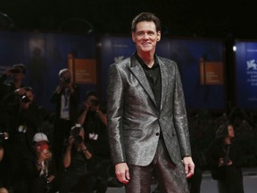FILE - In this Sept. 5, 2017, file photo, actor Jim Carrey poses for photographers at the premiere of the film 'Jim and Andy: The Great Beyond' at the 74th edition of the Venice Film Festival in Venice, Italy. Carrey is being criticized on social media for a portrait he painted and tweeted Saturday, March 17, 2018, that is believed to be White House Press Secretary Sarah Huckabee Sanders.