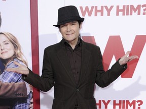 FILE - In this Dec. 17, 2016, file photo, Corey Feldman attends the world Premiere of "Why Him?" in Los Angeles. Los Angeles police are investigating an attack on actor Feldman. Officer Drake Madison says Feldman was stopped at an intersection with a passenger in his vehicle when an unknown male made a stabbing motion at the actor's stomach around 10:45 p.m. Tuesday, March 27, 2018. Police say Feldman drove himself to a hospital, where he's in stable condition.
