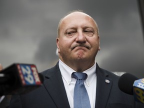 FILE - In this July 27, 2017, file photo, Allentown Mayor Edwin Pawlowski speaks with members of the media outside the federal building in Philadelphia. The mayor of Allentown, Pa., announced his resignation Thursday, March 8, 2018, a week after being convicted on federal corruption charges.