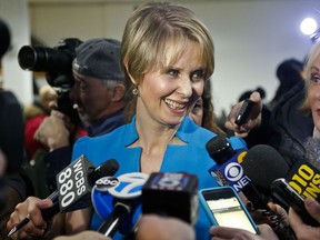Candidate for New York governor Cynthia Nixon speaks with reporters at her first campaign stop, Tuesday March 20, 2018, in the Brownsville section of Brooklyn, in New York. Nixon will challenge New York Gov. Andrew Cuomo for the Democratic nomination.