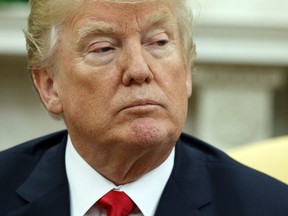 FILE- In this March 6, 2018, file photo, President Donald Trump listens to a question during a meeting with Swedish Prime Minister Stefan Lofven in the Oval Office of the White House in Washington. Trump plans to meet with representatives from the video game industry on Thursday, March 8.