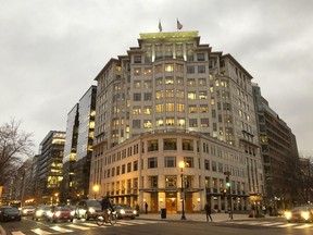 This March 1, 2018, photo provided by Reveal shows JPMorgan Chase & Co.'s sole location in the Washington area, which is on the ninth floor of the building across the street from the White House. The office is not open to the public. (Amy Walters/Reveal via AP)