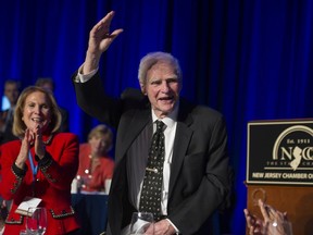 FILE – In this April 22, 2014, file photo, former New Jersey Gov. Brendan Byrne waves as the audience sings him "Happy Birthday" and his wife Ruthi Zinn Byrne applauds, to mark his 90th birthday during the annual "Congressional Dinner" of the New Jersey State Chamber of Commerce in Washington, D.C. A ceremony at Healy's Tavern in Jersey City on Friday, March 16, 2018, will honor Byrne, who died in January at age 93. Byrne used to joke he wanted his ashes placed in Hudson County, known for its history of political shenanigans, so he could stay active in politics.