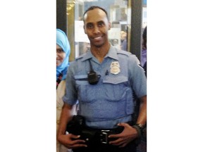 FILE - In this May 2016 file photo provided by the City of Minneapolis, police Officer Mohamed Noor poses for a photo at a community event welcoming him to the Minneapolis police force.  Noor, a Minneapolis police officer who shot and killed an Australian woman in July 2017,  turned himself in Tuesday, March 20, 2018, after a warrant was issued for his arrest, but the nature of the charges against him were not immediately known.  (City of Minneapolis via AP, File)