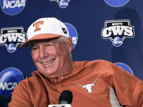 FILE - In this June 12, 2009, file photo, Texas coach Augie Garrido smiles before the baseball coaches traditional news conference ahead of the NCAA College World Series at Rosenblatt Stadium in Omaha, Neb. Garrido, who won three national baseball championships at Cal State Fullerton and two more at Texas, has died, the University of Texas announced Thursday, March 15, 2018. He was 79.