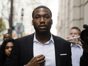 FILE - In this Nov. 6, 2017 file photo, rapper Meek Mill arrives at the criminal justice center in Philadelphia. The mother of jailed rapper Meek Mill is calling on Philadelphia's district attorney to "step in" and help her son. The Philadelphia Inquirer reports the plea by Kathy Williams came during a brief news conference Tuesday before the start of a criminal justice panel at the University of Pennsylvania. Williams strongly criticized the judge who sentenced Mill to two to four years in prison last fall for violating probation on a roughly decade-old gun and drug case.