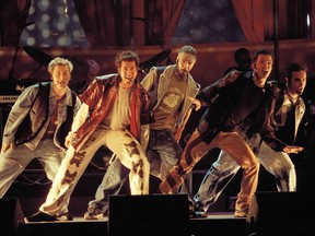 FILE - In this June 3, 2000 file photo, members of NSync, from left, Lance Bass, Joey Fatone, Justin Timberlake,  JC Chasez and Chris Kirkpartrick perform at the 9th annual MTV Movie Awards in Culver City, Calif. The boy band will earn a star on the Hollywood Walk of Fame on April 30.