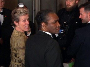 This image taken from video shows Oscar winner Frances McDormand, foreground left, walking into the Governors Ball next to Terry Bryant, center, the man accused of stealing her Academy Award on Sunday, March 4, 2018 in Los Angeles. McDormand won the best actress category for her role in "Three Billboards Outside Ebbing, Missouri."