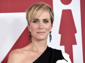FILE - In this Dec. 18, 2017 file photo, Kristen Wiig, a cast member in "Downsizing," poses at a special screening of the film in Los Angeles. Wiig will play a villain in the next "Wonder Woman" film. Director Patty Jenkins announced on Twitter Friday that Wiig will star as Wonder Woman rival Cheetah in the superhero sequel.