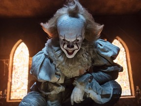 This image released by Warner Bros. Pictures shows Bill Skarsgard as the evil clown Pennywise in a scene from the film "It," based on the book by Stephen King.