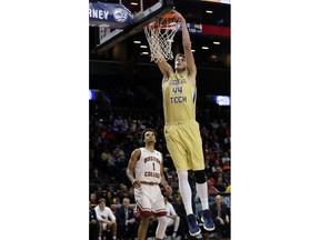 Georgia Tech's Ben Lammers (44) dunks the ball in front of Boston College's Jerome Robinson (1) during the first half of an NCAA college basketball game in the first round of the Atlantic Coast Conference tournament Tuesday, March 6, 2018, in New York.