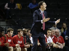 Louisville head coach David Padgett calls out to his team during the first half of an NCAA college basketball game against Florida State in the second round of the Atlantic Coast Conference tournament Wednesday, March 7, 2018, in New York.