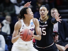 South Carolina's Alexis Jennings (35) defends against Connecticut's Napheesa Collier, left, during the first half of a regional final at the a women's NCAA college basketball tournament Monday, March 26, 2018, in Albany, N.Y.