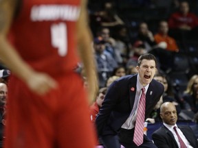 Louisville head coach David Padgett calls out to his team during the second half of an NCAA college basketball game against Florida State in the second round of the Atlantic Coast Conference tournament Wednesday, March 7, 2018, in New York. Louisville won 82-74.