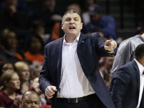 Boston College head coach Jim Christian calls out to his team during the first half of an NCAA college basketball game against Clemson in the quarterfinal round of the Atlantic Coast Conference tournament Thursday, March 8, 2018, in New York.