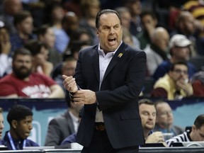 Notre Dame head coach Mike Brey calls out to his team during the first half of an NCAA college basketball game against Pittsburgh in the first round of the Atlantic Coast Conference tournament Tuesday, March 6, 2018, in New York.