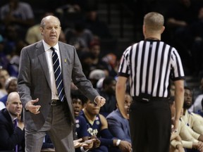 Pittsburgh head coach Kevin Stallings argues a call with a referee during the first half of an NCAA college basketball game against Notre Dame in the first round of the Atlantic Coast Conference tournament Tuesday, March 6, 2018, in New York.