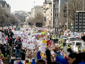 In this March 24, 2018, photo, people hold the "March for Our Lives" rally in Washington in support of gun control. They have walked out, marched and demanded action across America to stop gun violence. But it's far from certain that the young people behind the "March for Our Lives" movement will be a political force at the ballot box this fall.