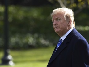 FILE - In this March 23, 2018, file photo, President Donald Trump walks across the South Lawn of the White House in Washington, as he heads to Marine One for a short trip to Andrews Air Force Base. Looking to get ahead in Trump's Washington? Borrow his media playbook. With suggestive statements, cryptic tweets, provocative lawsuits and must-see television interviews, Trump's political foils are using some of his own tactics to grab - and keep - the spotlight.