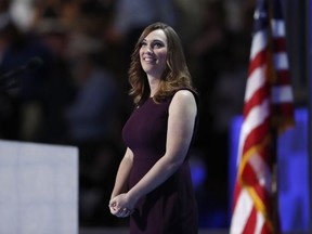 FILE - In this July 28, 2016, file photo, LGBT rights activist Sarah McBride takes the stage during the final day of the Democratic National Convention in Philadelphia. Activist groups are turning to television ads to pressure the White House into allowing transgender people to keep serving in the military. McBride, Human Rights Campaign's spokeswoman, said it's a "critical window of time" to take the fight directly to the White House.