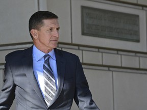 FILE - In this Dec. 1, 2017, file photo, former Trump national security adviser Michael Flynn leaves federal court in Washington. Disgraced former National Security Adviser Michael Flynn is campaigning for a Republican congressional candidate in California. He endorsed Republican Omar Navarro in his challenge of 14-term Democratic Rep. Maxine Waters at a campaign event in La Quinta, Friday, March 16, 2018.