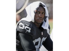 FILE - In this Sept. 20, 2015, file photo, Oakland Raiders' Aldon Smith cools off during an NFL football game against the Baltimore Ravens in Oakland , Calif. Police are searching for suspended Smith, who is suspected of domestic violence. San Francisco police said Sunday, March 4, 2018, that Smith fled a San Francisco home Saturday night after someone called the police to report a domestic violence incident.