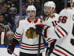 Chicago Blackhawks forwards Thomas Jurco (13) and Artem Anisimov (15) celebrate a goal during the second period of an NHL hockey game against the Buffalo Sabres, Saturday, March 17, 2018, in Buffalo, N.Y.