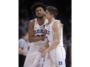 Duke forward Marvin Bagley III (35) and guard Grayson Allen (3) react after Allen scored against Notre Dame during the first half of an NCAA college basketball game in the Atlantic Coast Conference men's tournament Thursday, March 8, 2018, in New York.