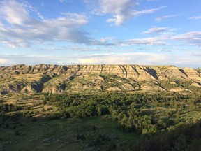 FILE - This June 18, 2017, file photo shows the scenic landscape near the Theodore Roosevelt National Park in western North Dakota. Roosevelt hunted and ranched in the area in the 1880s. Theodore Roosevelt credited his time hunting and ranching in North Dakota with shaping him into the man who would become the nation's 26th president. Now, enthusiasts are working to establish a Theodore Roosevelt Presidential Library in the North Dakota Badlands where he spent nearly four years in the late 1800s.