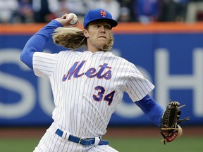 New York Mets' Noah Syndergaard (34) delivers a pitch during the first inning of a baseball game against the St. Louis Cardinals Thursday, March 29, 2018, in New York.