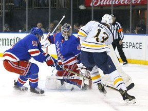 New York Rangers defenseman John Gilmour (58) and New York Rangers goaltender Alexandar Georgiev (40) defend against a shot by Buffalo Sabres right wing Nicholas Baptiste (13) during first period of an NHL hockey game, Saturday, March 24, 2018, in New York.