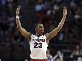 FILE - In this March 6, 2018 file photo Gonzaga's Zach Norvell Jr. raises his hands to the crowd during the first half of the West Coast Conference tournament championship NCAA college basketball game against BYU in Las Vegas. Norvell is providing Gonzaga with fiery spark on the way to the Sweet 16. Norvell hit tiebreaking 3-pointer in NCAA Tournament opening round and scored 28 points in second round.