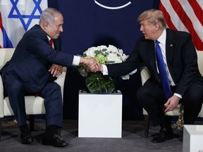 FILE - This Jan. 25, 2018 file photo shows President Donald Trump meeting with Israeli Prime Minister Benjamin Netanyahu at the World Economic Forum in Davos. There's much to celebrate but plenty of cause for trepidation, too, as Trump and Netanyahu meet Monday, March 5, 2018 at the White House. For all his talk about brokering the "ultimate deal" between Israelis and Palestinians, Trump's long-awaited peace plan has yet to arrive, even as Palestinians and other critics insist it will be dead on arrival.